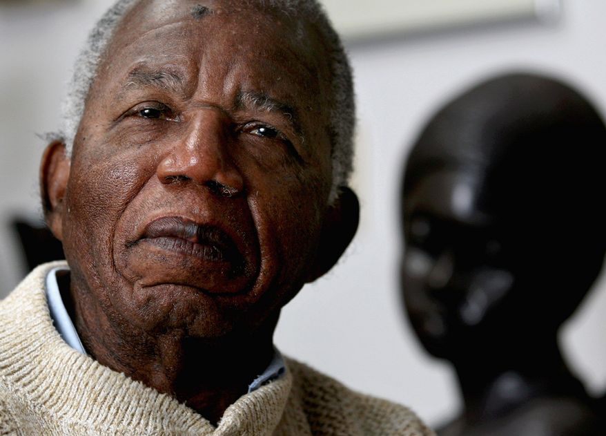 Chinua Achebe, a Nigerian-born novelist and poet, is viewed by many as a pre-eminent voice of dissent and conscience in his native country, from which he has again turned down a national honor. (Associated Press)