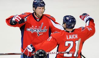 Because of assorted ailments to Capitals defensemen, Dennis Wideman (left) has been playing more minutes and forward Brooks Laich has spent time on the blue line. (Associated Press)