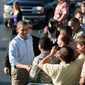 President Obama greets a crowd at Joint Base Pearl Harbor-Hickam Field in Honolulu on Tuesday before flying to Australia. Republicans are chiding the president for the time he&#39;s spending abroad as a budget deadline nears. (Associated Press)