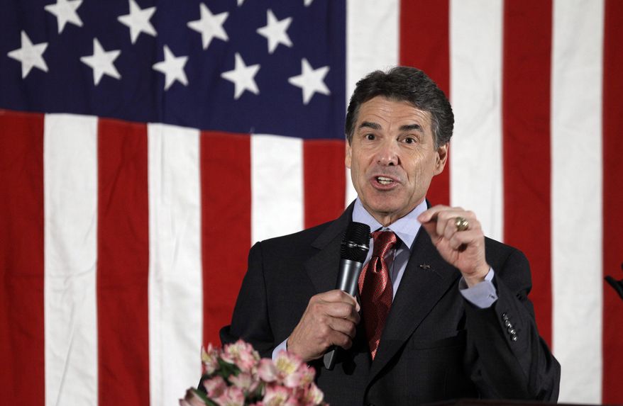 Texas Gov. Rick Perry speaks Nov. 14, 2011, during the Scott County Republican Party&#39;s Ronald Reagan Dinner in Bettendorf, Iowa. (Associated Press)