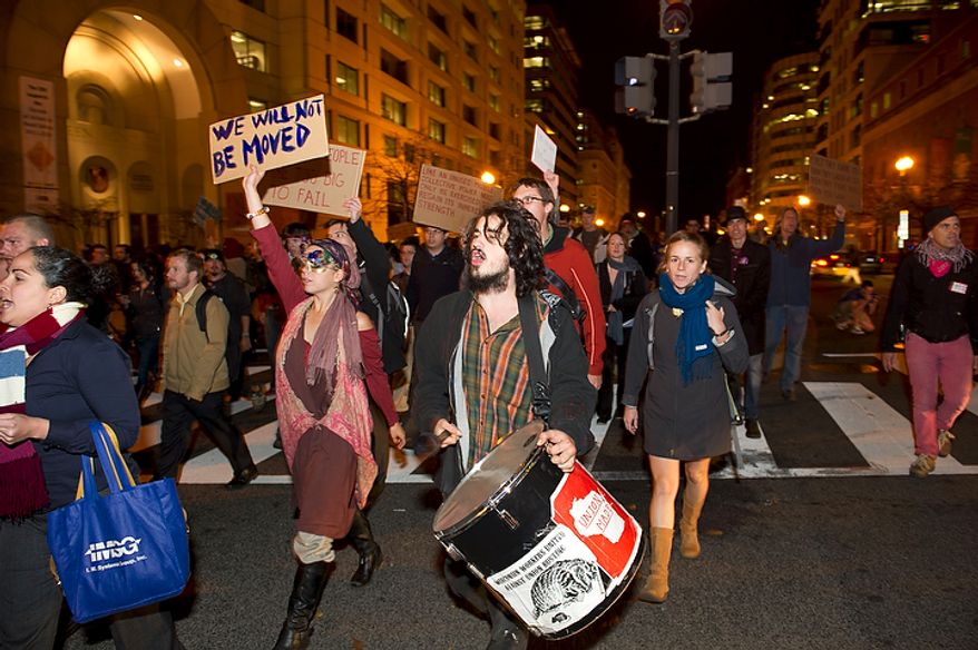 Demonstrators with the Occupy D.C. take to the streets of downtown Washington, D.C., Tuesday, Nov. 15, 2011, to show support for the Occupy Wall Street movement. (Rod Lamkey Jr./The Washington Times)