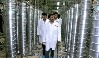 ** FILE ** In this Tuesday, April 8, 2008, file photo released by the Iranian President&#39;s Office, Iranian President Mahmoud Ahmadinejad, center, visits the Natanz Uranium Enrichment Facility some 200 miles (322 kilometers) south of the capital Tehran, Iran. (AP Photo/Iranian President&#39;s Office, File)