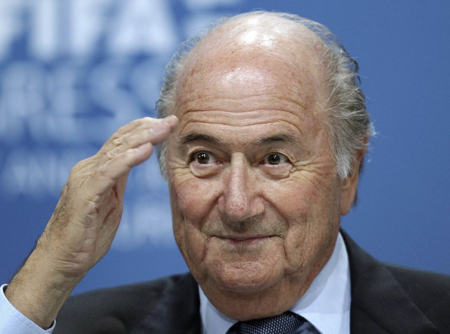 **FILE** Swiss FIFA President Sepp Blatter reacts June 1, 2011, during a press conference after the 61st FIFA Congress in Zurich, Switzerland. (Associated Press)