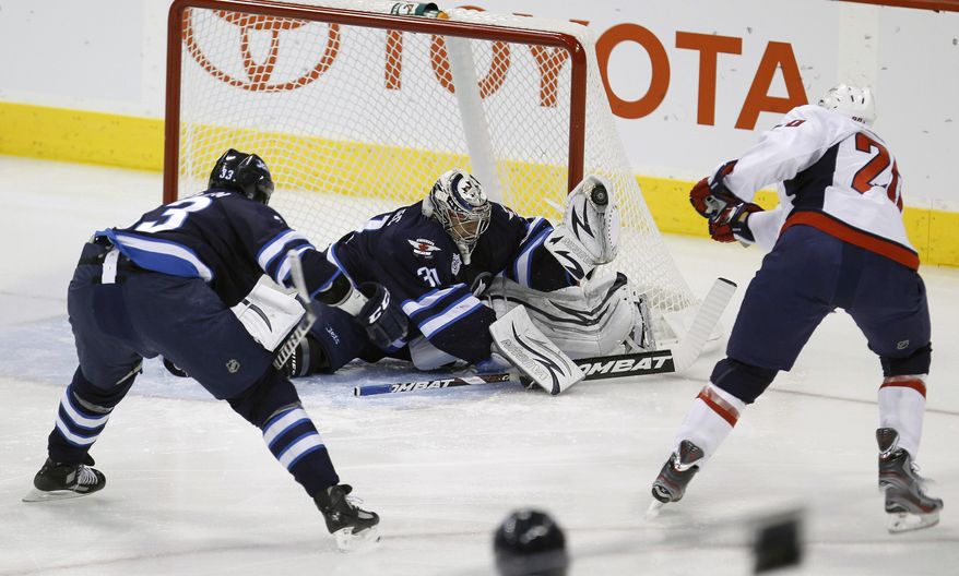 Washington Capitals' Troy Brouwer has received just over two minutes of power play time a game, yet has no points to show for it. The Caps' success rate on the man advantage has fallen to 10th in the league, and it's coincided with the loss of defenseman Mike Green. (AP Photo/The Canadian Press, Trevor Hagan)