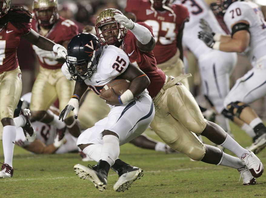 Virginia players celebrate their 14-13 victory over Florida State on Saturday, Nov. 19, 2011, in Tallahassee, Fla.(AP Photo/Steve Cannon)