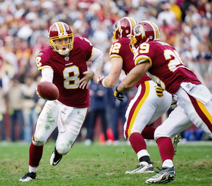 Rex Grossman (left) had a 65.8 completion percentage in Sunday's loss to Dallas. It was his highest mark since completing 71.4 percent for Chicago in Super Bowl XLI on Feb. 4, 2007. (Andrew Harnik/The Washington Times)