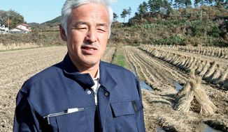 SOLITARY MAN: Others left after the nuclear meltdown in Fukushima, but Naoto Matsumura didn&#39;t. He lives alone with only the animals he feeds. (Christopher Johnson/The Washington Times)