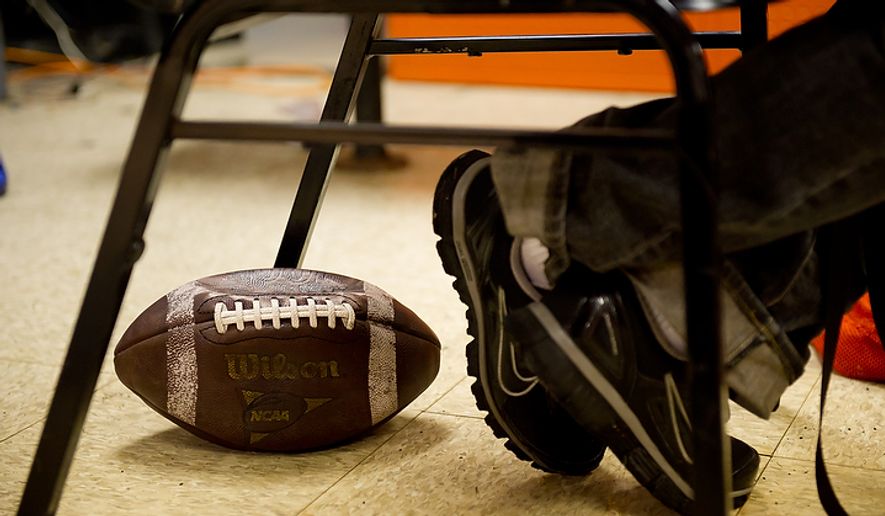 In this file photo, a high school football coach sits in the locker room prior to practice in Washington, D.C., November 21, 2011. (Andrew Harnik/The Washington Times) **FILE**
