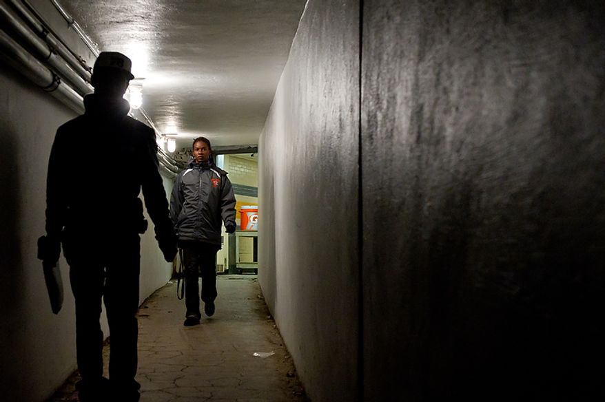 Coolidge High School Football Coach Natalie Randolph heads to the field for practice to get her team ready for the Turkey Bowl, Washington, DC, Monday, November 21, 2011. (Andrew Harnik/The Washington Times)