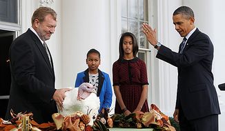 President Obama, with daughters Sasha and Malia, pardons Liberty, a 19-week-old, 45-pound turkey, at the White House on Nov. 23, 2011, the day before Thanksgiving. At left is National Turkey Federation Chairman Richard Huisinga. (Associated Press)