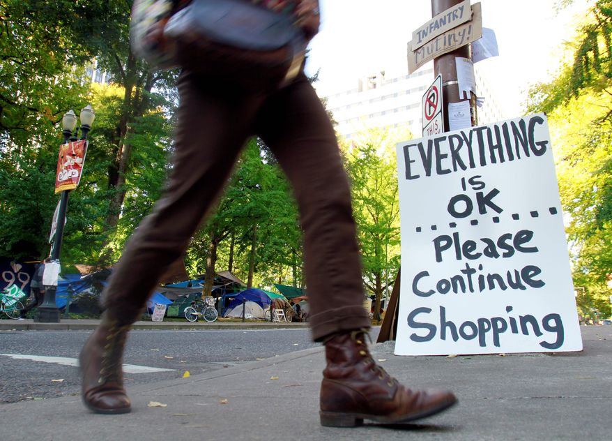 A sign is posted as a joke at an entrance to the Occupy Portland camp Oregon. Occupy protesters want shoppers to boycott door-buster sales at big-box stores on Black Friday. (Associated Press)