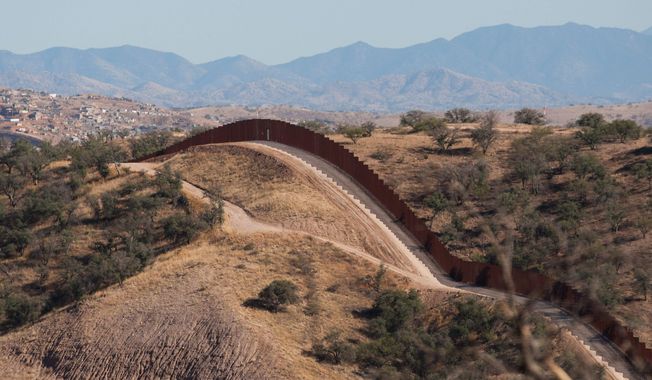 This portion of a border fence stretches west of Nogales, Ariz., into the Coronado National Forest. An Arizona lawmaker, Republican state Sen. Steve Smith, who is leading an effort to build additional fences near the state&#x27;s border with Mexico through donations, said he expects to begin construction on more barriers next year. (The Arizona Republic via Associated Press)
