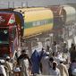** FILE ** NATO fuel tankers enter Afghanistan through Pakistan&#39;s border crossing in Torkham, east of Kabul, on Oct. 10, 2010. (AP Photo/Rahmat Gul)