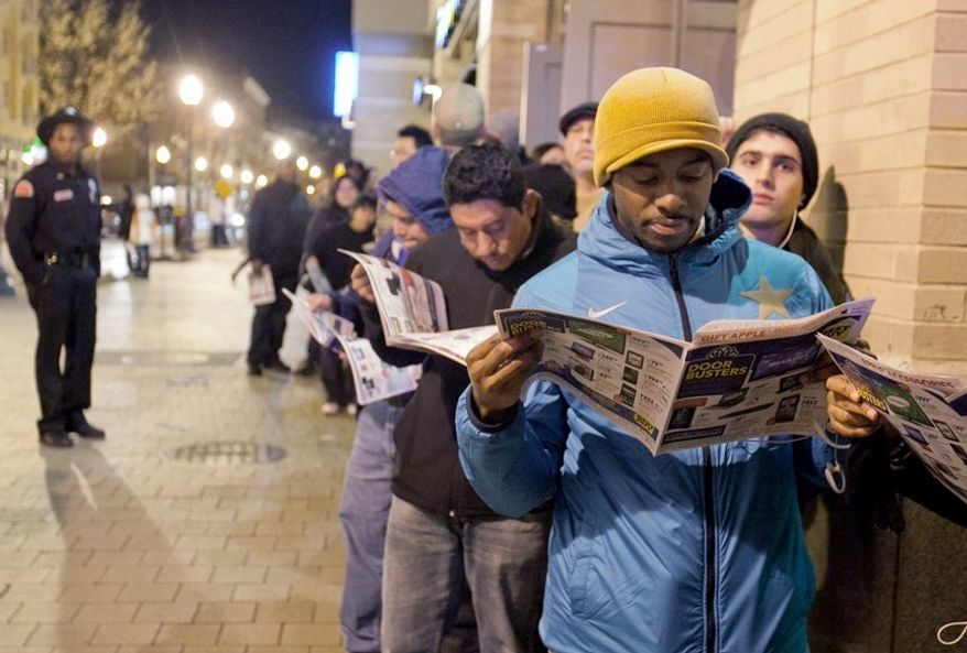 The lines were long as customers waited for the DC USA shopping center on 14th Street Northwest to open for Black Friday sales. (Andrew S. Geraci/The Washington Times)