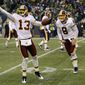 Washington Redskins&#39; Anthony Armstrong celebrates his touchdown with quarterback Rex Grossman  in the fourth quarter against the Seattle Seahawks, Sunday, Nov. 27, 2011, in Seattle. (AP Photo/Ted S. Warren)