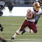 Washington Redskins Roy Helu runs downfield in the first half of an NFL football game against the Seattle Seahawks. (AP Photo/Elaine Thompson)
