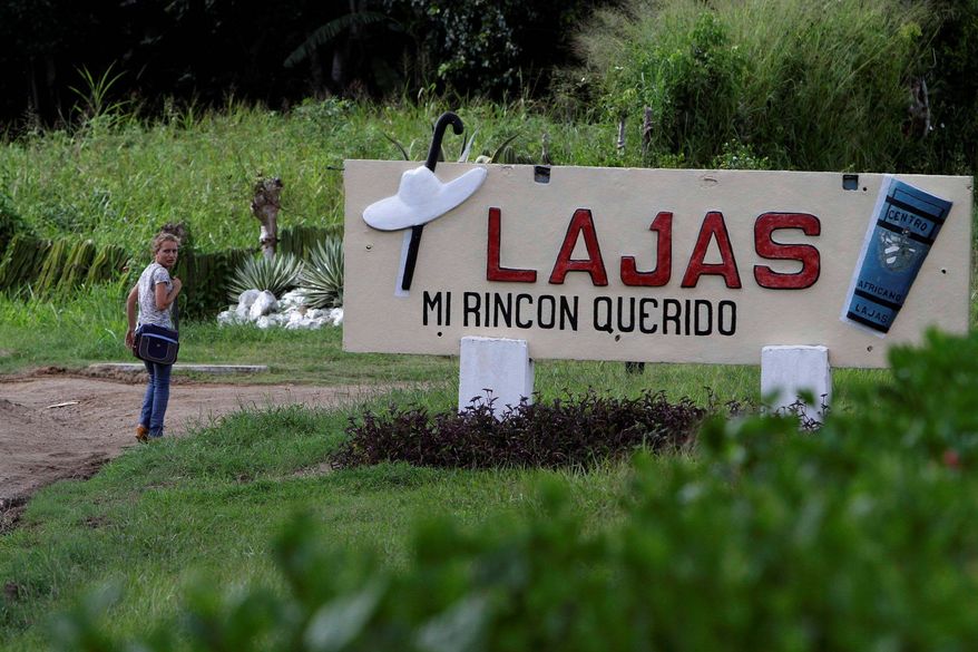 The entrance to Santa Isabel de Las Lajas bears the name of native son Benny More's 1955 song "Lajas, Mi Rincon Querido" ("Lajas, My Beloved Place"). Small businesses are sprouting where the once-lucrative sugar-cane industry has declined. (Associated Press)