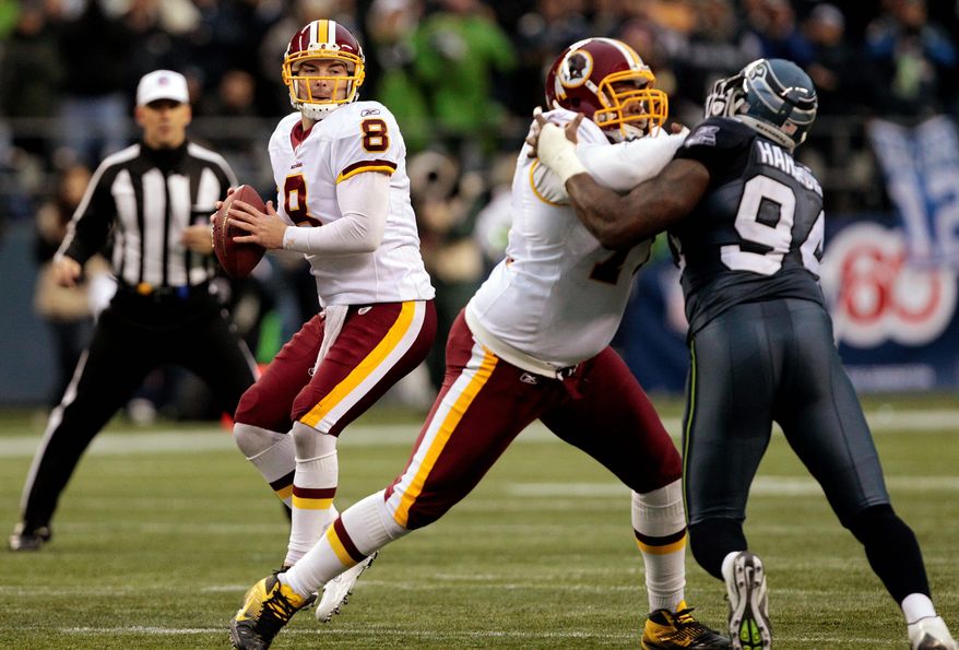 Rex Grossman is among the multiple players who received high marks for their performances Sunday in Seattle. (Associated Press)