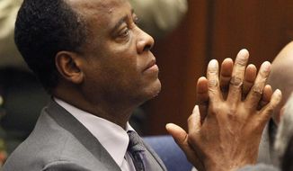 Dr. Conrad Murray sits in Los Angeles Superior Court on Tuesday, Nov. 29, 2011, after being sentenced to four years in jail for the involuntary manslaughter of pop star Michael Jackson. (AP Photo/Mario Anzuoni, Pool)