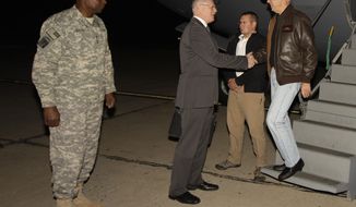 Gen. Lloyd Austin (left), the top U.S. commander in Iraq, looks on as Vice President Joseph R. Biden Jr. (right) shakes hands with the James Jeffrey, the U.S. ambassador to Iraq, upon Mr. Biden&#39;s arrival in Baghdad on Tuesday, Nov. 29, 2011. (AP Photo/Khalid Mohammed)