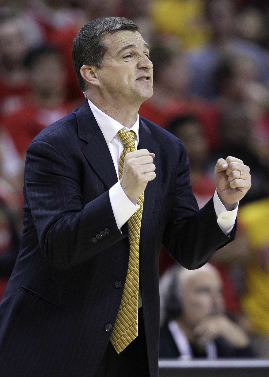 Maryland coach Mark Turgeon directs his players in the second half of an NCAA college basketball game against Illinois in College Park, Md., Tuesday, Nov. 29, 2011. Illinois won 71-62. (AP Photo/Patrick Semansky)