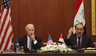 U.S. Vice President Joseph R. Biden Jr. (left) and Iraqi Prime Minister Nouri al-Maliki hold a joint news conference in Baghdad on Wednesday, Nov. 30, 2011. (AP Photo/Khalid Mohammed)