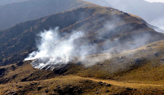 ** FILE ** Smoke rises after a reported NATO airstrike in Pakistan&#x27;s tribal area of Mohmand, along the Afghanistan border, on Saturday, Nov. 26, 2011. (AP Photo/Pakistan Inter Services Public Relations Department)

