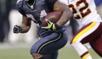 ** FILE ** Seattle Seahawks Marshawn Lynch, right, runs under pressure from Washington Redskins Kevin Barnes in the second half of an NFL football game, Sunday, Nov. 27, 2011, in Seattle. (AP Photo/Ted S. Warren)
