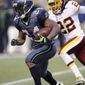 ** FILE ** Seattle Seahawks Marshawn Lynch, right, runs under pressure from Washington Redskins Kevin Barnes in the second half of an NFL football game, Sunday, Nov. 27, 2011, in Seattle. (AP Photo/Ted S. Warren)