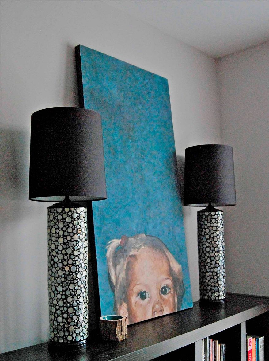 Photo courtesy of Jessica Bonness
Switching out an ivory lampshade for something more dramatic, such a s a black drum shade, can give any room an updated, modern touch.