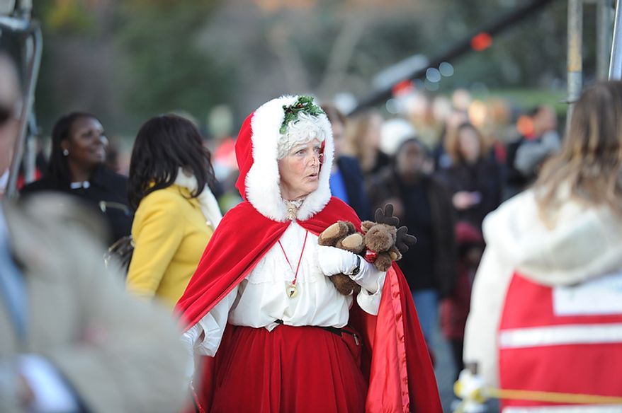 Mrs. Santa makes her way through the crowd during The National Christmas Tree Lighting 2011 on The Elipse in Washington, DC, Thursday, December 1, 2011. (Rod Lamkey Jr/ The Washington Times)
