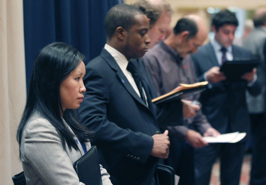 ** FILE ** In this Nov. 14, 2011, file photo, job seekers line up to speak to recruiters during a career expo in Las Colinas, Texas. (AP Photo/LM Otero, File)