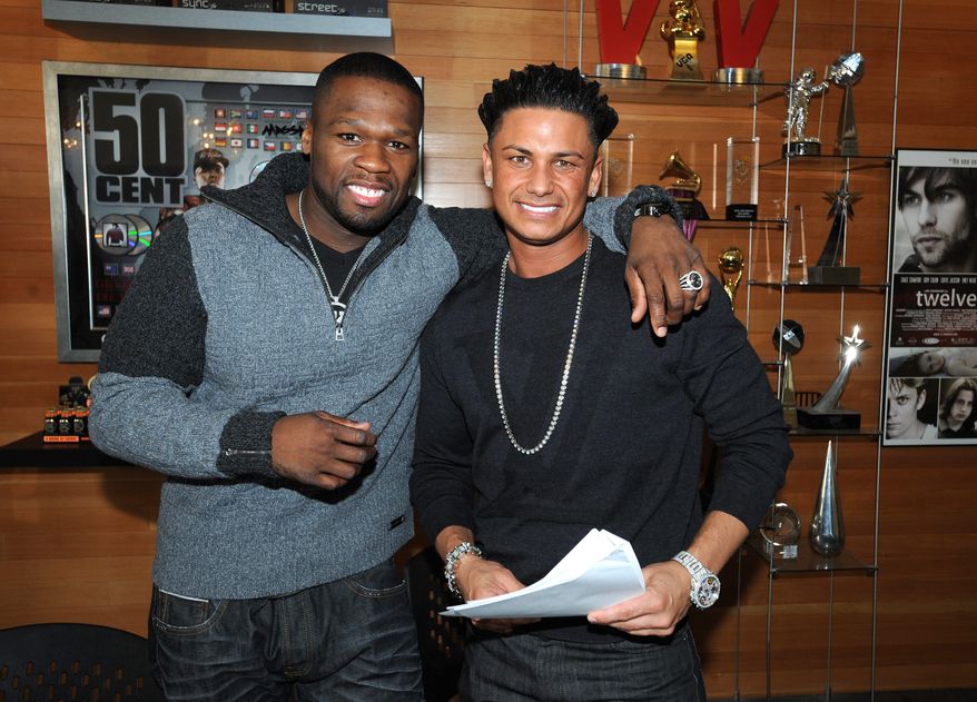 DJ Pauly D (right) has signed a record deal with 50 Cent's G-Note label, which focuses on dance and pop music. The "Jersey Shore" star has been in music since he was 15 and opened for Britney Spears' recent tour a few times. (Associated Press)