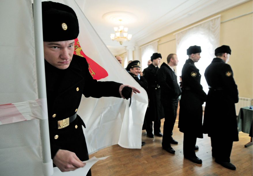 Russian sailors line up to cast their ballots at the polling station for a fleet base in Sevastopol, Ukraine. (Associated Press)