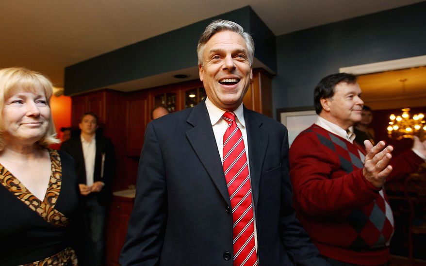 Republican presidential candidate Jon Huntsman Jr. arrives at a house party hosted Thursday by Don and Melinde Byrne in Bedford, N.H. Mr. Huntsman has written off Iowa, and has spent neither time nor money campaigning there. (Associated Press)
