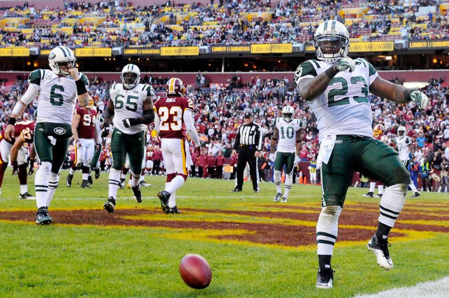 New York Jets running back Shonn Greene (23) celebrates his fourth quarter touchdown that put the Jets up 27-16 in the fourth. (Preston Keres/For The Washington Times)