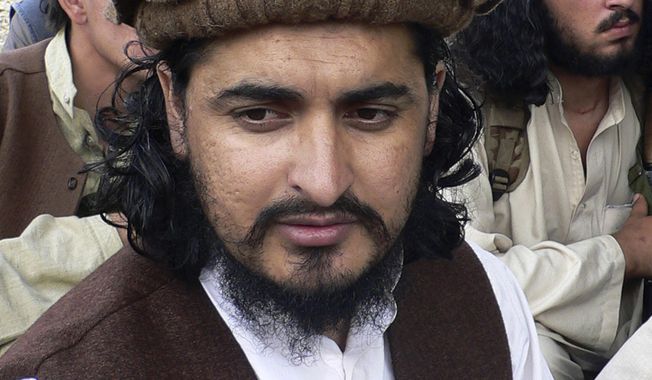 ** FILE ** Pakistani Taliban chief Hakimullah Mehsud is pictured in Sararogha in the Pakistani tribal area of South Waziristan along the Afghanistan border in October 2009. (AP Photo/Ishtiaq Mehsud, File)