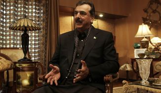 ** FILE ** Pakistani Prime Minister Yousuf Raza Gilani gives an interview at his home on Monday, Dec. 5, 2011. (AP Photo/Muhammed Muheisen)
