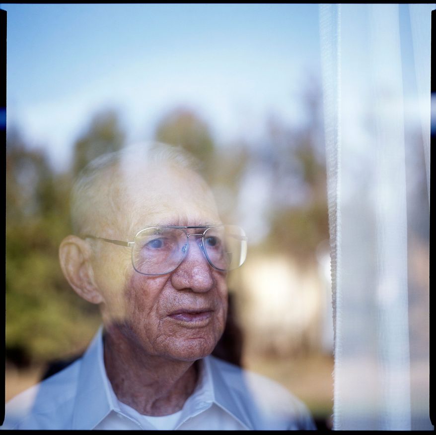 Clarence Davis, 88, enlisted in the Navy at 17 and joined the U.S.S. Medusa repair ship as a Seaman 2nd Class once he arrive at Pearl Harbor. Though he trained to be a radio operator, Davis was working as a mess cook until the attack on Pearl Harbor on Dec. 7, 1941. After the attack he was put on radio work full time, and served on nine ships and worked at three schools over course of his 20 years in the service. Davis retired a Senior Chief and eventually became a president of the Pearl Harbor Survivors Association. Davis is seen at his home in Charlotte Hall, Md. on Oct. 18, 2011.
(T.J. Kirkpatrick/ The Washington Times)
