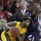 Maryland guard Sean Mosley, left, tries to drive past Illinois guard Brandon Paul as Illinois coach Bruce Weber, background, looks on in the first half of an NCAA basketball game in College Park, Md., Tuesday, Nov. 29, 2011. (AP Photo/Patrick Semansky)