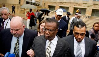 **FILE** Former Prince George&#x27;s County Executive Jack Johnson walks out of the U.S. District Courthouse in Greenbelt, Md. (Andrew Harnik/The Washington Times)