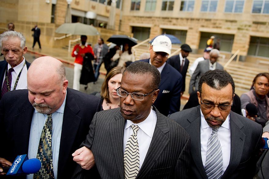 **FILE** Former Prince George's County Executive Jack Johnson walks out of the U.S. District Courthouse in Greenbelt, Md. (Andrew Harnik/The Washington Times)