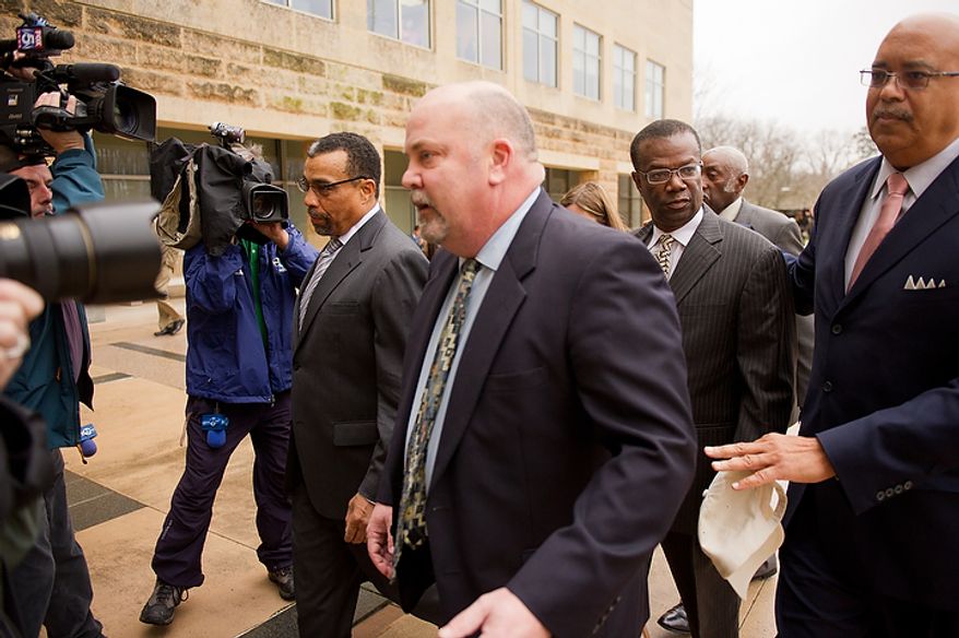 Former Prince George's County Executive Jack Johnson walks into the U.S. District Courthouse in Greenbelt, Md., on Tuesday, Dec. 6, 2011, for his sentencing after being found guilty for corruption in a pay-to-play scandal. Also pictured is his lawyer Billy Martin, left. (Andrew Harnik/The Washington Times)