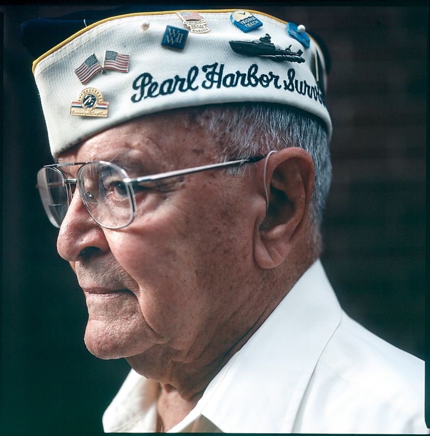 Jay Groff, 89, served in the Army Air Corps Rescue Boat Service at Pearl Harbor, Oahu. Groff was in bed as the Japanese attack on Pearl Harbor began, which he says probably saved his life. Groff calls the attack the most important day of the 20th century, adding that "the world changed for the United States." He goes on to say, "I grew up overnight.... That morning, I realized that there was somebody out there trying to kill me. That changed my outlook on life." Groff is seen at his home in Springfield, Va. on Nov. 21, 2011. (T.J. Kirkpatrick/ The Washington Times)