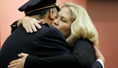 Maureen Faulkner, widow of Philadelphia police Officer Daniel Faulkner, and Philadelphia Police Commissioner Charles H. Ramsey embrace at news conference Wednesday. Faulkner&#39;s killer is no longer facing the death penalty. (Associated Press)
