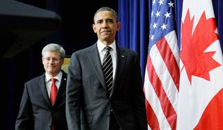 President Obama and Canadian Prime Minister Stephen Harper appeared in front of reporters Dec. 7, 2011, to answer questions after meeting at the White House about border issues, including the Keystone oil pipeline project. (Associated Press) **FILE**