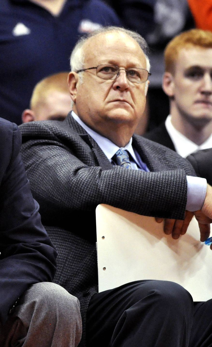 **FILE** Syracuse basketball assistant coach Bernie Fine watches a college basketball game against Manhattan in the NIT Season Tip-Off in Syracuse, N.Y., on Nov. 14, 2011. (Associated Press)