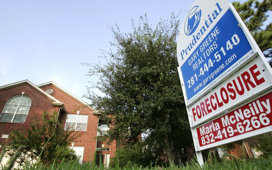 ** FILE ** A foreclosure home for sale is shown in this Aug. 22, 2006, file photo taken in Spring, Texas. If the U.S. economy does not suffer more setbacks, the rate of mortgage holders behind on their payments should decline significantly by the end of next year, according to credit reporting agency TransUnion. (AP Photo/David J. Phillip, File)