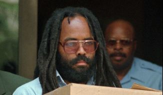 In this July 12, 1995, file photo, Mumia Abu-Jamal leaves Philadelphia&#39;s City Hall after a hearing. District Attorney Seth Williams announced Wednesday, Dec. 7, 2011, that prosecutors will no longer pursue the death penalty against the former Black Panther, meaning he will spend the rest of his life in prison for gunning down a white police officer nearly 30 years ago. (AP Photo/Chris Gardner, File) ** FILE ** 