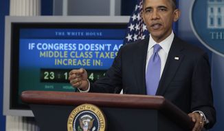President Barack Obama speaks during a news conference in the White House briefing room in Washington, Thursday, Dec. 8, 2011. (AP Photo/Carolyn Kaster)